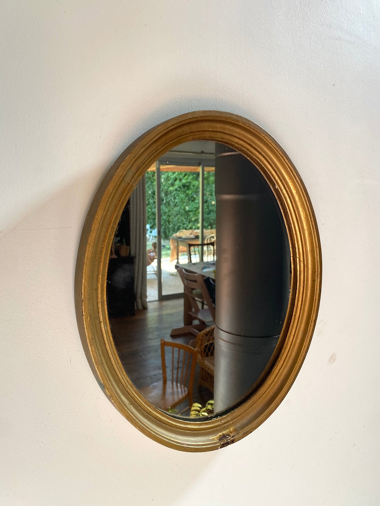 Miroir ovale en bois doré