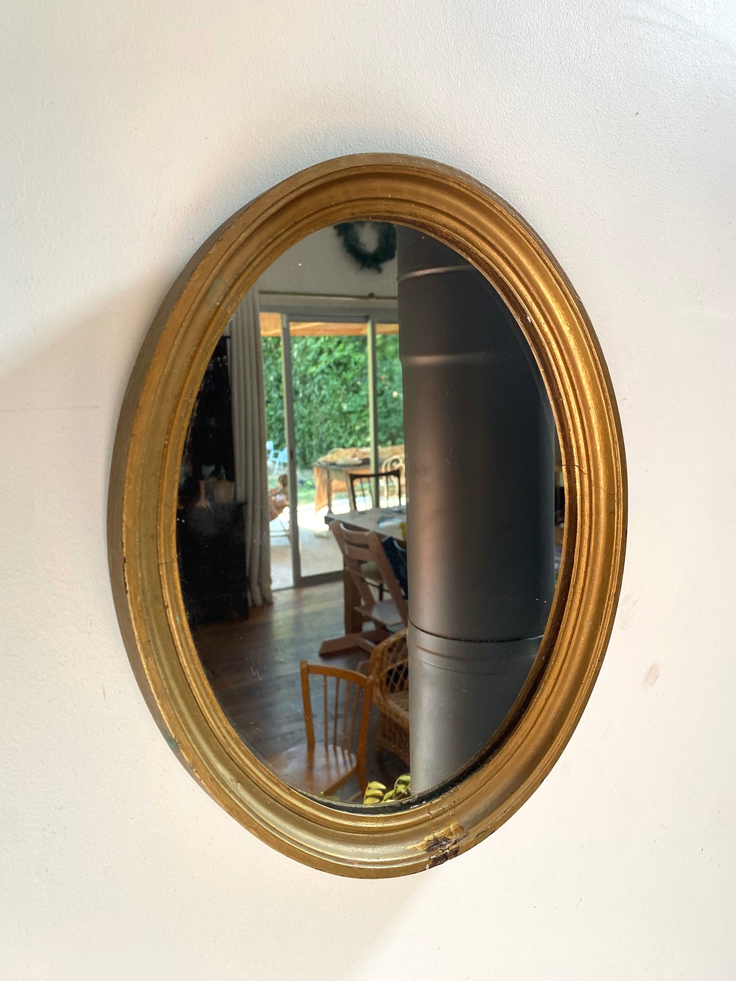 Miroir ovale en bois doré